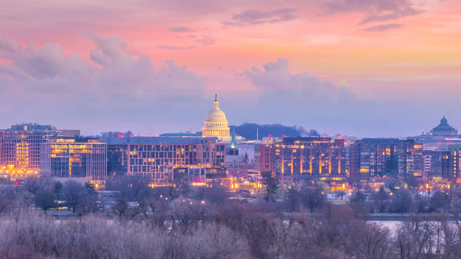 Washington, DC skyline at dusk with the U.S. Capitol dome lit up