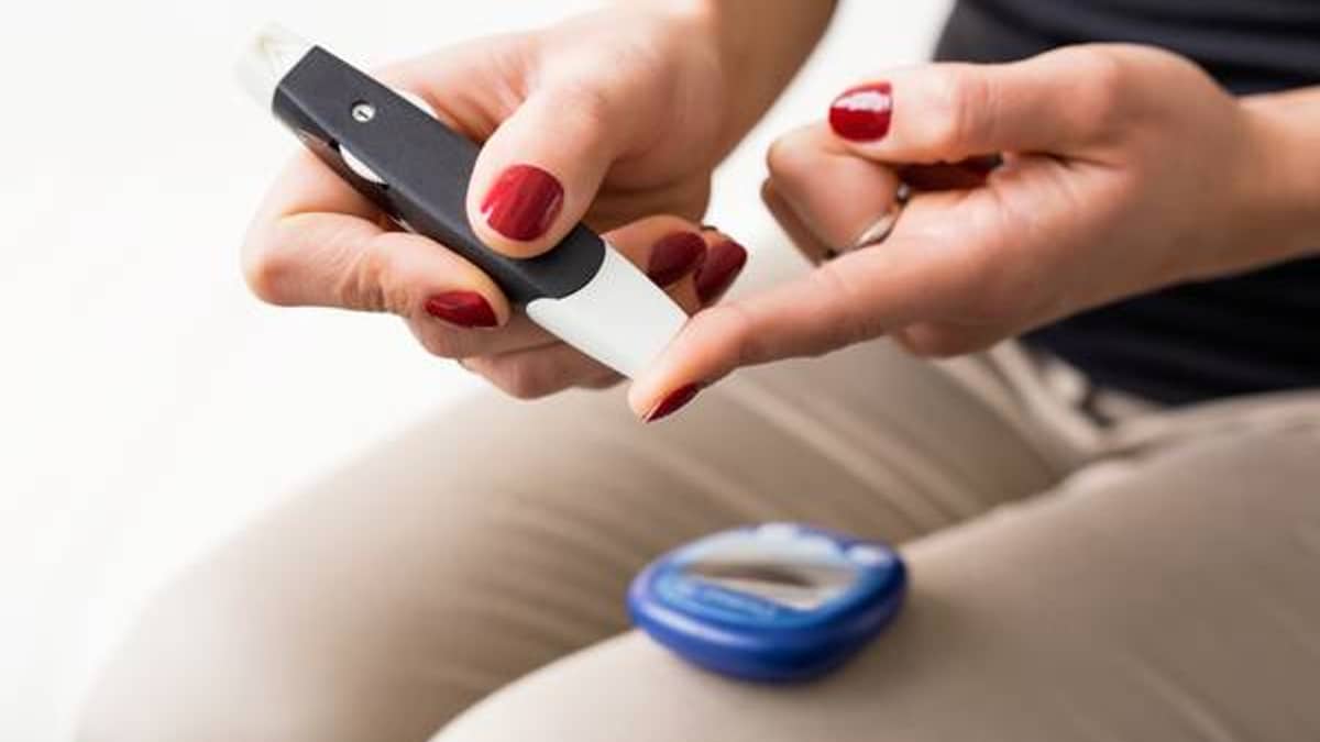 Woman checking her blood sugar with a finger test